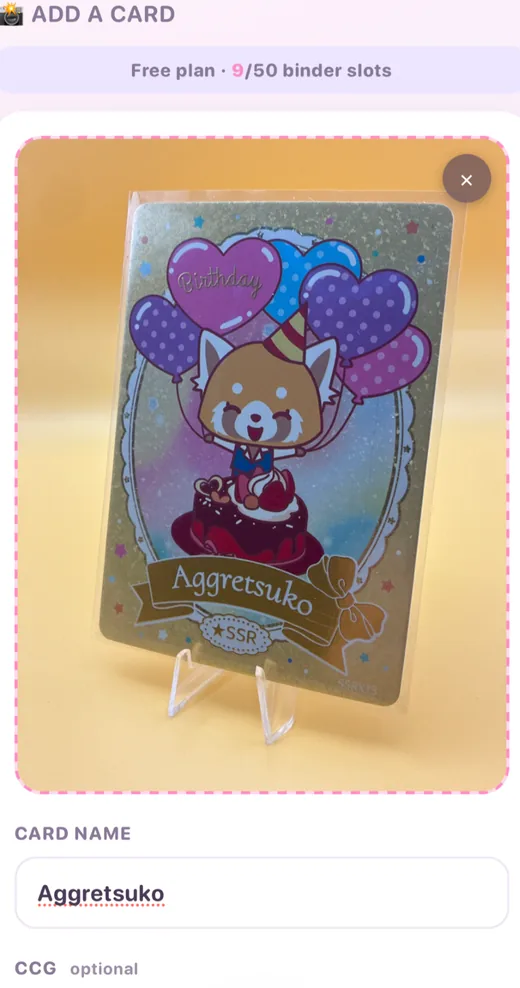 The add a card screen in the CardCuteCollect app, showing a photographed Aggretsuko card above a card name field.